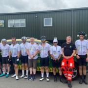 The team of cyclists and their support at the end of their fundraising cycle