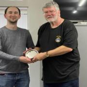 Basingstoke Chess club treasurer Peter Beldaus (right) presents Steven Jones with a silver salver from the club for his British Chess Championship success