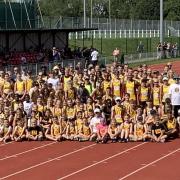 Basingstoke and Mid Hants athletes get together for a group photo at Down Grange.