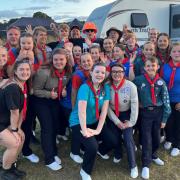 Basingstoke Gang Show cast and volunteers with Chris Evans at CarFest