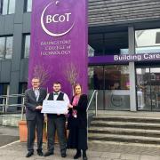 Mason with his cheque outside Basingstoke College of Technology