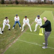 Cllr Kerry Morrow (batting) with members of the Capital Cricket Club in slip positions