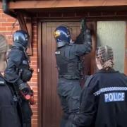 Police carrying out a warrant at an address on Highpath Way in Basingstoke on Monday, March 4.