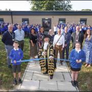 Pupils and staff at St Monica Primary School, Sholing, Southampton, at the grand opening last year of the newly redeveloped school. The school has been praised for a second consecutive year in a quality assurance review by a national education charity,