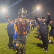 Paul Strudley lifting the trophy
