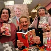 John Challis with fans Tracey Randall, left, and Susan Randall in Basingstoke's Waterstones