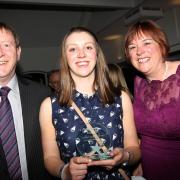 Helen Frawley, centre, with parents Tim and Linda