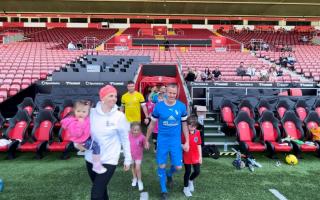 Emm and Alice leading the teams out to the ground for the charity match at St Mary's stadium
